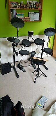 Alesis DM6 electronic drum kit including amplifier and sticks